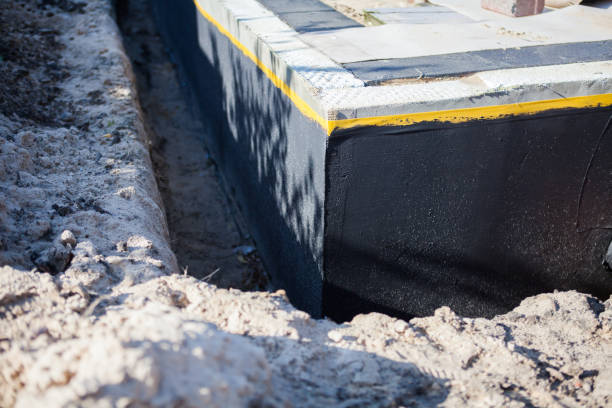 Professional Waterproofing technician working in Piedmont, AL